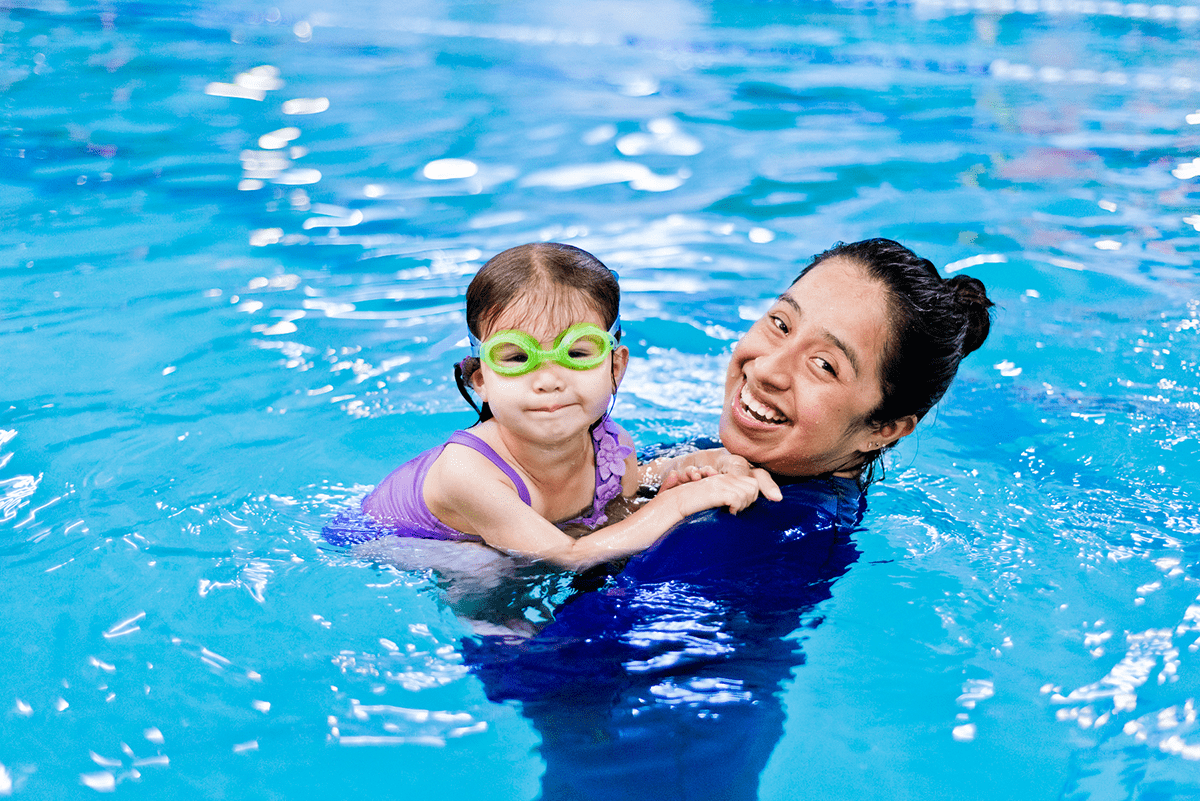 Child with swim instructor